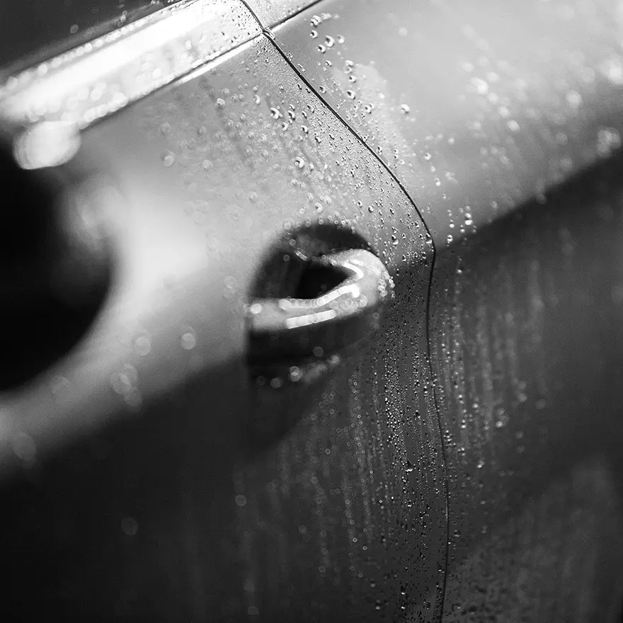 Water beading on freshly cleaned car surface, demonstrating premium wash and protective finish by Tasman Autowash